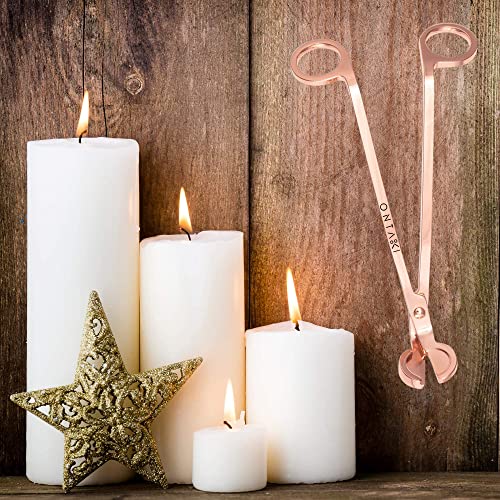 Premium ONTAKI candle wick trimmer with ergonomic design in Rose Gold next to lit candles and decorative star.
